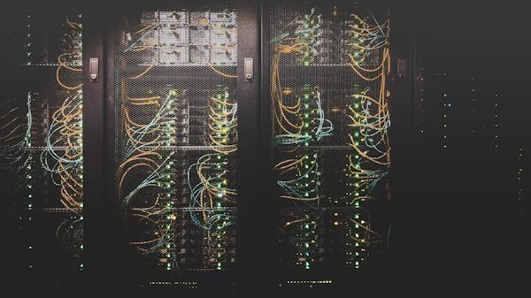 Network cables plugged into a server rack